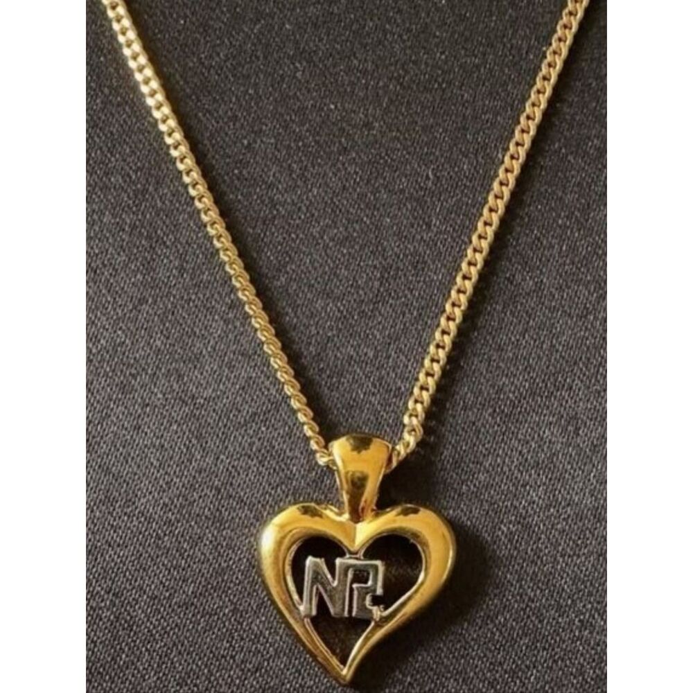 Nina Ricci gold-tone heart pendant necklace.